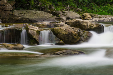 background landscape with waterfall in Yaremche vilage in Ukraine