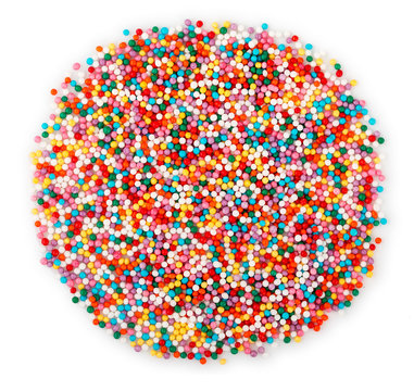 Round heap of colorful sprinkles for baking, isolated on white background. Top view, Close up.