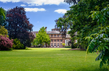 Mansion and landscaped gardens,Scenic view of historical mansion and landscaped formal gardens in summer