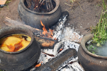 Clay pots for cooking natural wool on the bonfire