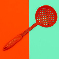 Kitchen accessories. Spoon of a colander.Minimal art style