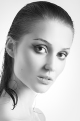 beautiful female portrait with bare shoulders on white background, monochrome