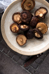 Dried shiitake mushroom on table background