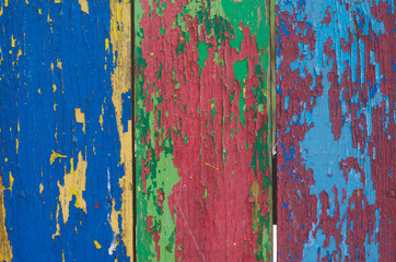 Wooden multicolored background with old paint