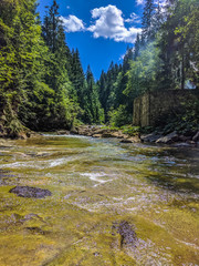 background landscape with waterfall in Yaremche vilage in Ukraine
