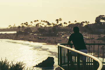 a man look at the ocean view. evening sunset. 