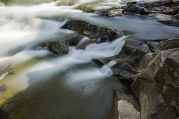 background landscape with waterfall in Yaremche vilage in Ukraine
