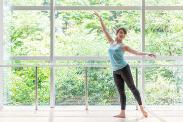 Fototapeta premium attractive asian woman doing ballet