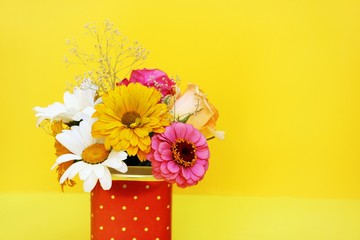 Bouquet of flowers on a yellow background