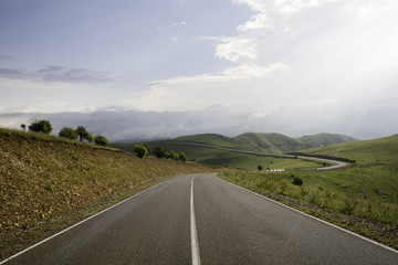 Fototapeta premium Smooth asphalt road to the mountains road