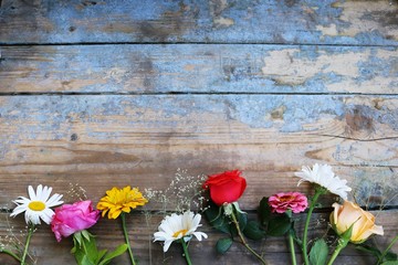 Bouquet of flowers on a wooden background