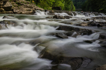 background landscape with waterfall in Yaremche vilage in Ukraine