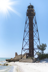 Old lighthouse on the shore of the Black sea, Dzharylhach island, Ukraine
