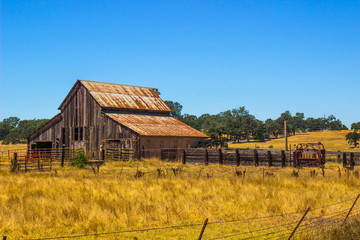Vintage Wooden Barn With Rusted Tin Roof © Tom