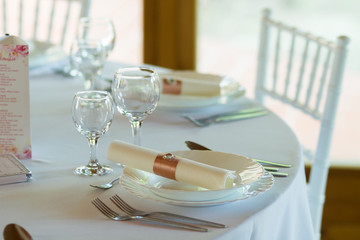 table setting with spoon, knife, plates and glass