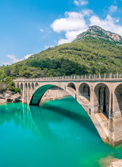 Bridge over the Ulldecona reservoir dam in Castellon of Spain - obrazy, fototapety, plakaty