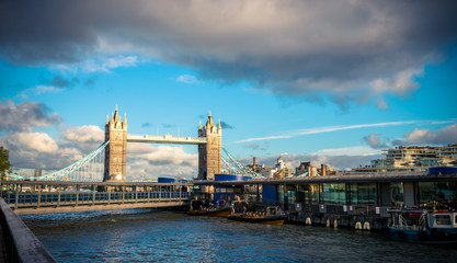 Fototapeta premium view of famous Tower Bridge over the River Thames, London, UK at cloudy day.