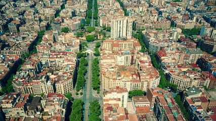 Aerial view of multiple drones flying and filming above Barcelona blocks pattern, Spain. 3D rendering