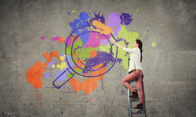 Obraz premium Girl paint wall in colors