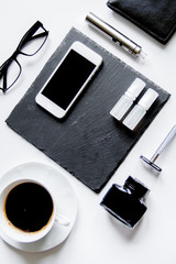 smartphone, electronic cigarette and men's accessories top view