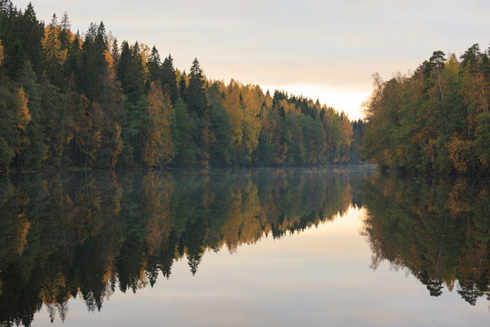 Calm autumn forest lake reflection © Juhku