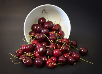 cherries spilling out of bowl