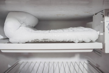 frozen Ice buildup in the freezer of refrigerator