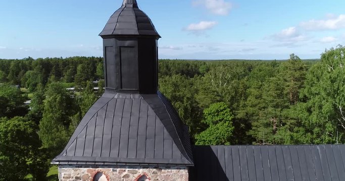 Korppoo, Cinema 4k aerial view around a church, revealing Korpo town, on a sunny summer day, in the finnish archipelago outside Turku, Varsinais-suomi, Finland