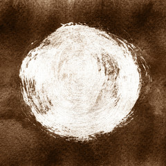 White textured acrylic circle on brown background.