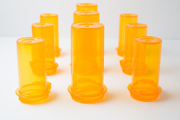 Amber-colored Prescription Drug Vials, on white, at f/11