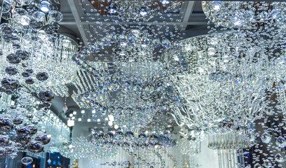 lighting balls on the chandelier in the lamplight, light bulbs hanging from the ceiling,q