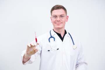 Caucasian man doctor prepare to make injection on white background
