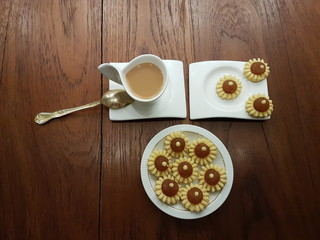 Tea time with delicious and pretty homemade pineapple tarts pastry in shapes of flower