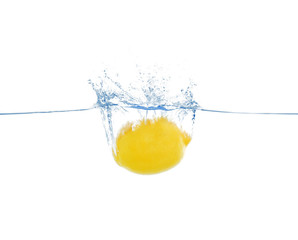 Lemon in water on white background