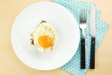 Delicious breakfast with sunny side up egg on table