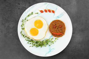 Delicious breakfast with sunny side up eggs on table