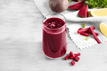 Healthy smoothie with beet root on wooden table