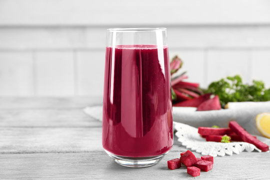 Healthy smoothie with beet root on wooden table
