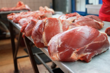 Fresh raw meat on counter in market