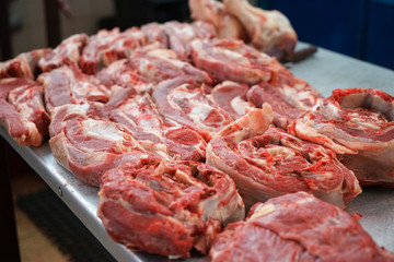 Fresh raw meat on counter in market