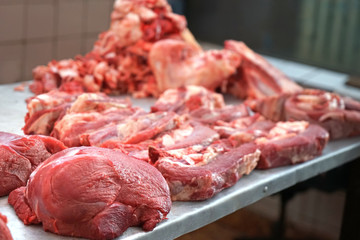 Fresh raw meat on counter in market