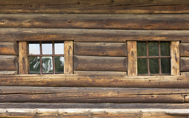 The wall of a dilapidated house from the log