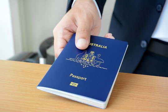 Hands giving passport