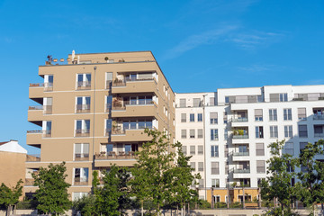 Fototapeta na wymiar Brown and white apartment houses seen in Berlin, Germany