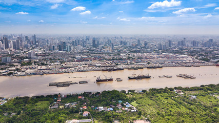 Aerial View of Bangkok skyline and view of Chao Phraya River View from green zone in Bang Krachao, Phra Pradaeng, Samut Prakan Province.