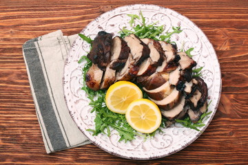 Roast fillet leg of lamb with greens and lemon