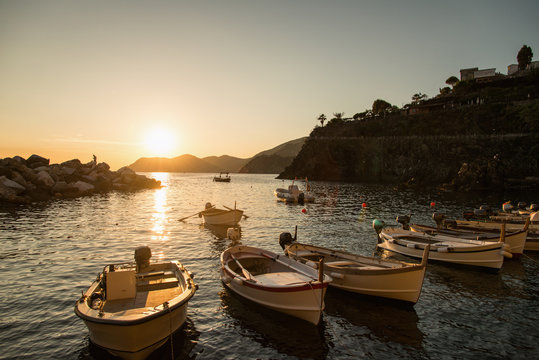 Golden sunset in small harbor of Cinque Terre
