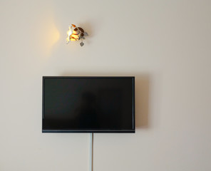 Black LED television screen hanging on the wall