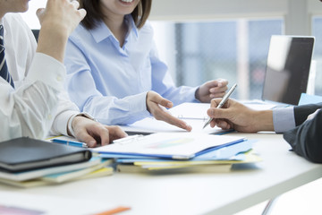 A man is signing a contract