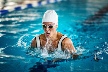 Female swimmer on training in the swimming pool